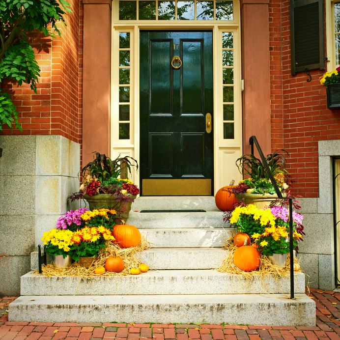 Pumpkins near the door during Halloween season